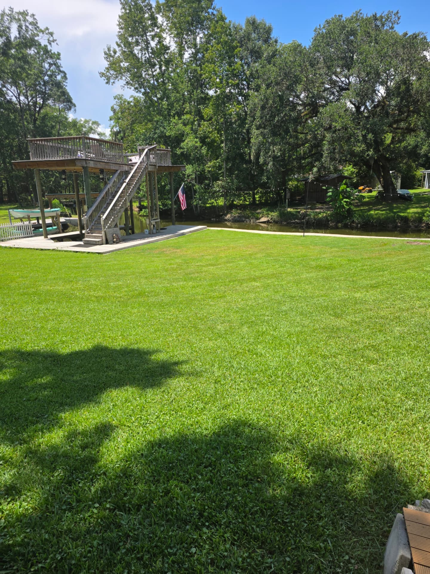 Restored waterfront lawn and dock area